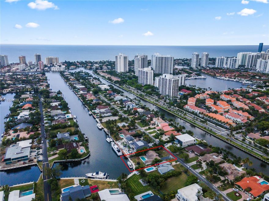 Discover the perfect opportunity to build your dream waterfront estate in an exclusive gated community. This oversized 12,949 SF lot features 85 linear feet of water frontage, no fixed bridges, with a brand-new seawall—ideal for boating enthusiasts and those seeking the ultimate waterfront lifestyle. Nestled in a serene neighborhood with parks and tennis courts, just 5 minutes from pristine beaches, and a short drive to Aventura Mall, world-class golf, and a premier casino. A city master plan is underway to enhance the neighboorhood area, making this property located in the most exclusive street, an exceptional investment for those who value luxury, family living, and breathtaking water views.