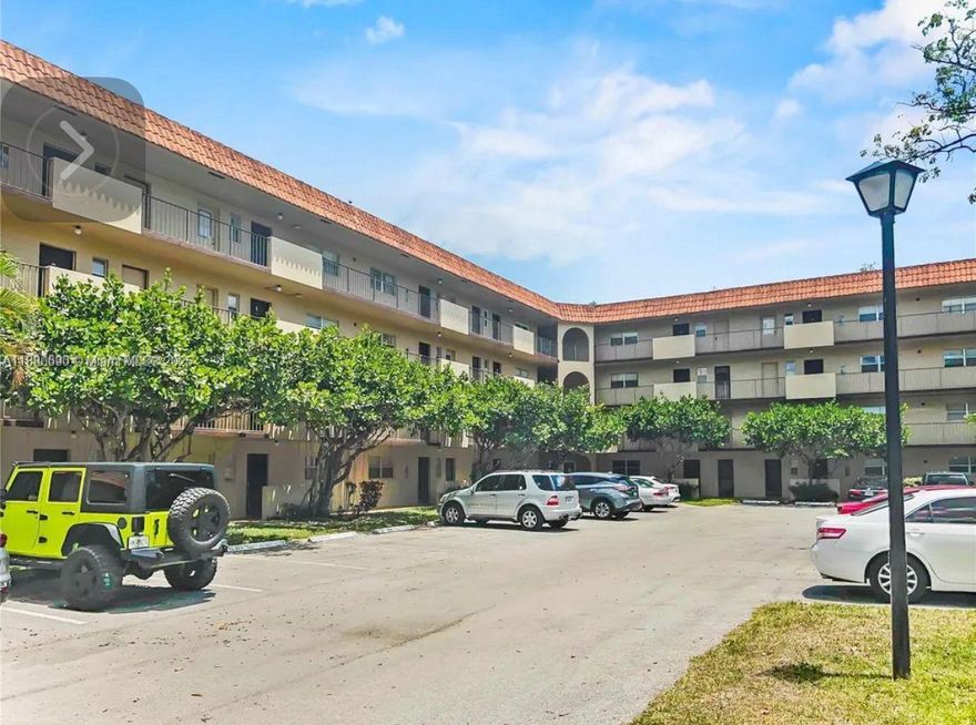Spacious 2 bedroom/2 2-bathroom condo. The property features a large screened balcony with a beautiful lake view, a brand new metal roof, and two guarded entrances with 24-hour surveillance. The unit is located on the second floor and has an elevator and stair access. Both bedrooms have walk-in closets and full bathrooms. Each floor has a laundry facility and an assigned storage room. Community offers well-kept landscaping, pest control, and 2 guarded entrances. HOA includes internet, water, cable, trash, and sewer.
