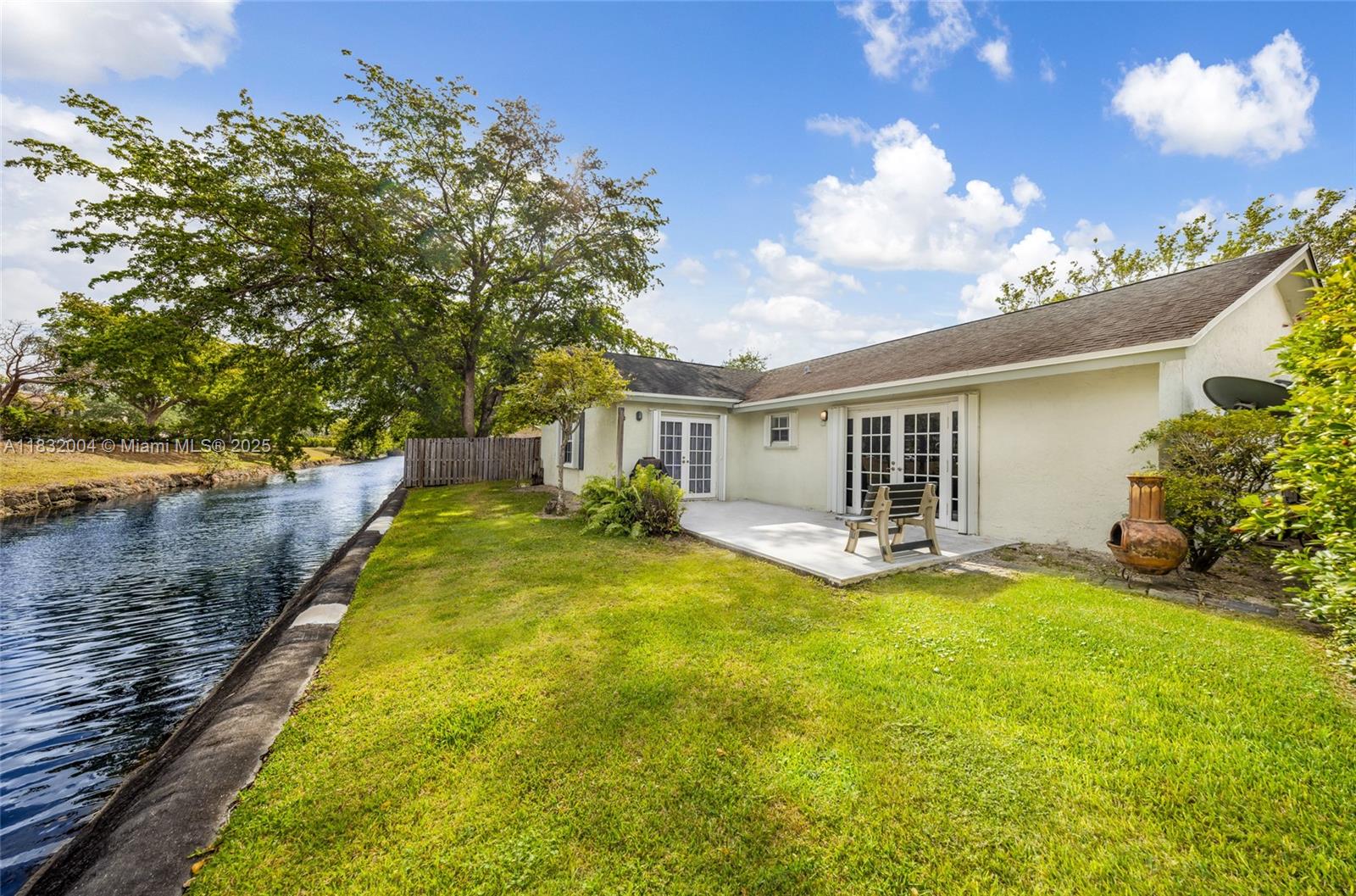 Discover this beautifully updated single-family home featuring serene canal views and nearly 2,000 sq. ft. of open concept living space. This 3-bed/2-bath residence offers comfort, style, and functionality in one of the area’s most sought-after neighborhoods. Step inside to find brand-new flooring throughout, including elegant and durable laminate. The spacious living areas boast high ceilings, abundant natural light, and a seamless flow — ideal for entertaining or relaxing with family. The upgraded kitchen is a chef’s delight, complete with modern cabinetry, sleek countertops, and stainless-steel appliances. Both bathrooms have been tastefully renovated. A cozy covered patio overlooks the tranquil canal — perfect for weekend BBQs. Freshly painted interiors, two-car garage.