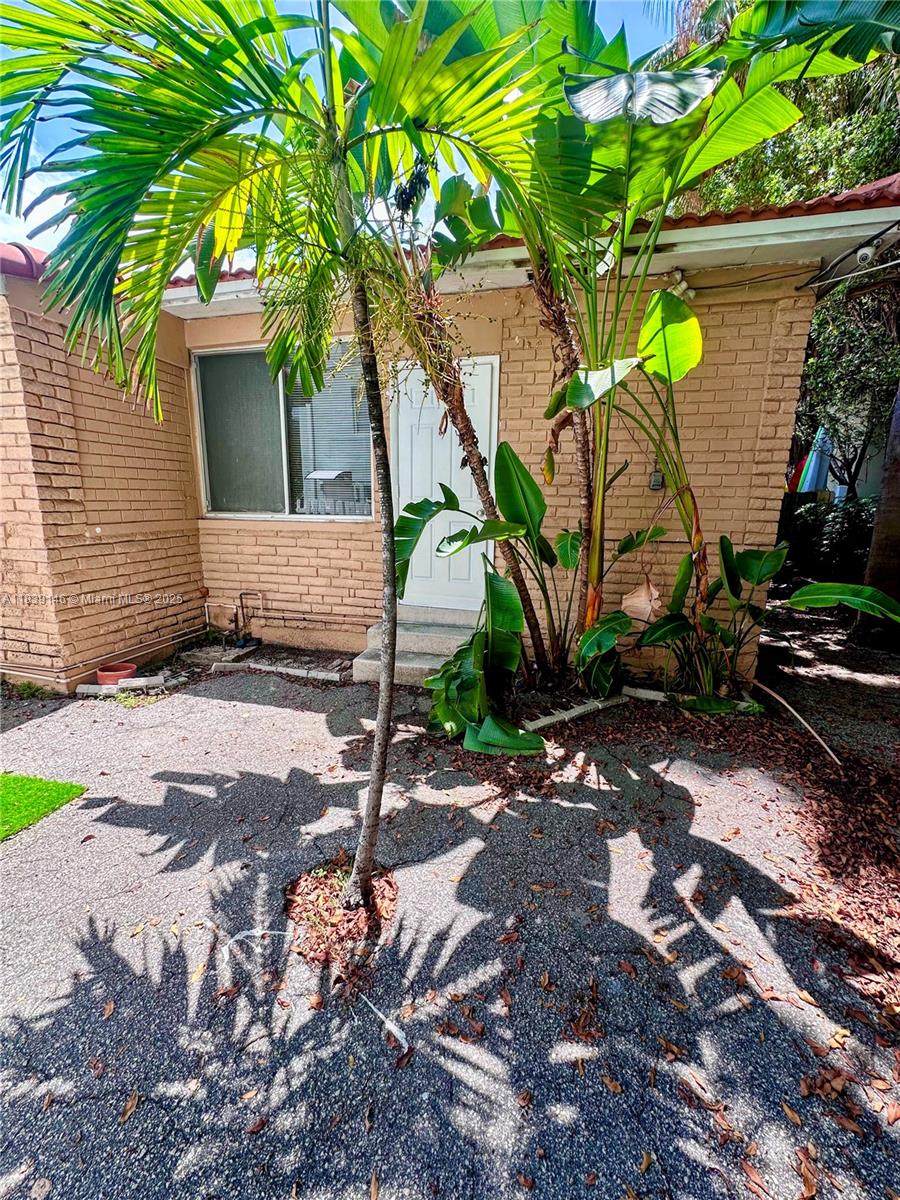 Best location! Rare private townhouse with an incredible, gated yard—spacious, fully fenced, and perfect for relaxing, pets, or entertaining. Your are just one block from the beach! Bedrooms are 13x14 and 8x16; the second is ideal for an office or den with a garden view. Wood and terrazzo floors, beautiful kitchen, huge great room, and new roof. super quiet, secluded, and away from the street. Includes 2 parking spots, security cameras, and memberships to beach, cabana, pickleball, and tennis. Walk to the ocean, shops, Bal Harbour, parks, and community events. Pet friendly ($65/mo). Gas fee $25/mo. First, last, and security required. One-year lease. Tenant pays cable, phone, and utilities. Available now—don’t miss this amazing yard and one-of-a-kind rental!