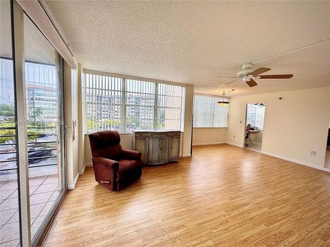 Photo of 1100 Saint Charles Pl #411, Pembroke Pines, FL 33026 (MLS # A11955067)