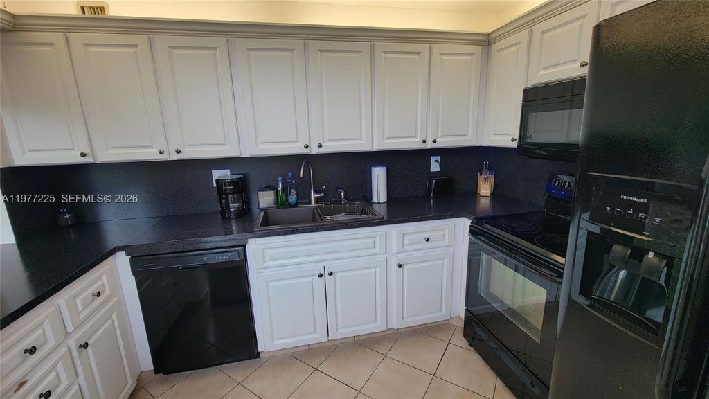 Photo of 9410 Tangerine Pl #407, Davie, FL 33324 (MLS # A11977225)