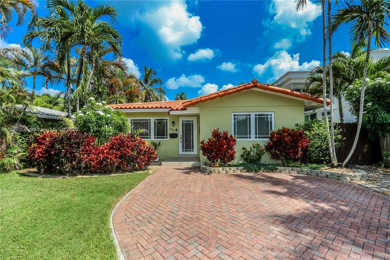Charming 2 bed/2 bath POOL home with flexible 3rd bedroom! Prime Hollywood Lakes location. Walk to beach/town. Kitchen features white cabinets, black granite counters, newer stainless steel appliances, gas stove, and farmers sink. Spacious layout includes living room and formal dining room. Versatile family room with closet to serve as a 3rd bedroom. Updated baths with marble mosaic flooring and rain showers. Guest bath has double sink and large two-person soaking tub. Step outside to a beautiful backyard oasis with solar-heated saltwater pool with built-in jacuzzi and waterfall, perfect for entertaining. Addit'l highlights: impact windows/doors, one-car garage, double driveway in front with extra rear parking, Newer elec water heater, lush landscaping, multiple outdoor entertaining areas.