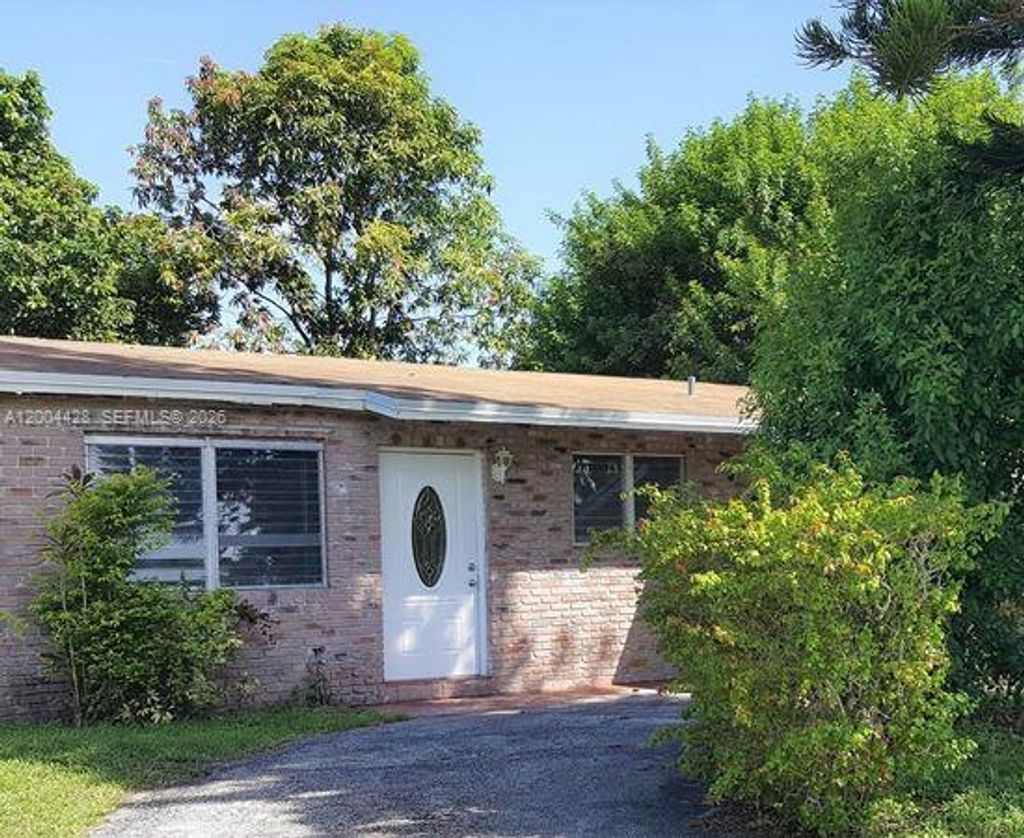 Photo of 5970 NW 42nd Ter, North Lauderdale, FL 33319 (MLS # A12004428)