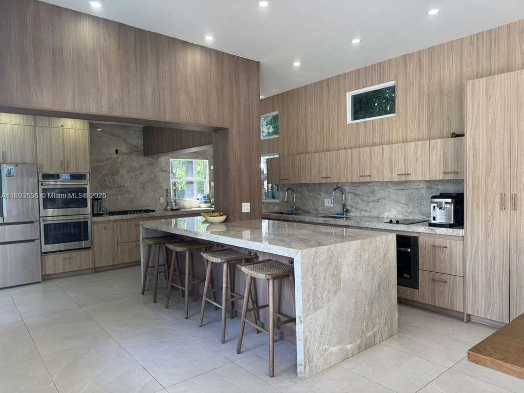 Welcome to this spacious 5-bedroom, 4-bathroom home located at 1333 Monroe St in Hollywood, FL. This stunning property boasts a modern kitchen with stainless steel appliances, granite countertops, and ample cabinet space. The open floor plan includes a large living room, perfect for entertaining guests. The master suite features a walk-in closet and en-suite bathroom with a luxurious soaking tub. Enjoy the Florida sunshine in the backyard oasis, complete with a sparkling pool and lush landscaping. This home is conveniently located near shops, restaurants, and parks, making it the perfect place to call home.