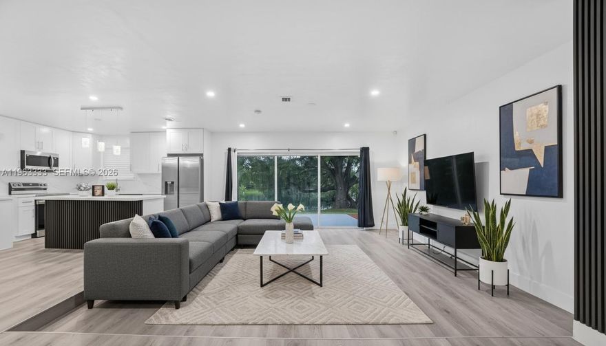 This completely remodeled 4-bedroom, 2-bath single family home is the turn-key retreat you’ve been searching for. With a brand-new roof, impact front door, updated plumbing and electrical, and remodeled bathrooms, no detail has been overlooked. The kitchen is a showstopper — featuring brand new appliances, custom wood cabinets, and stunning quartz countertops. Enjoy new luxury flooring throughout every room, including the beautifully converted garage offering a private fourth bedroom with separate entry — ideal for guests, in-laws, or rental income! Insurance discounts available thanks to storm protection features = LOWER MONTHLY PAYMENT. Unwind in your backyard as the sun sets over the tranquil lake — your private daily escape. This home checks every box and won’t last long. Schedule your private showing today and make it yours before someone else does!