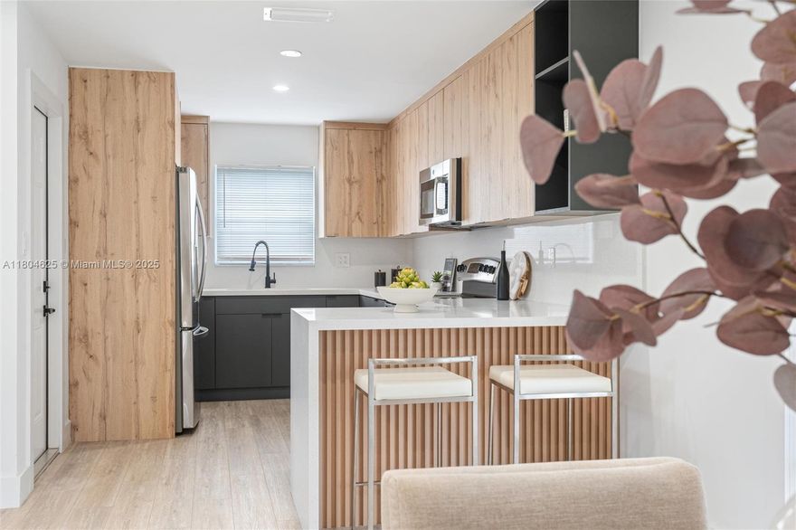 Fall in love with this beautifully renovated home in the heart of Pembroke Pines! Featuring an open-concept layout, abundant natural light, and designer finishes throughout. The modern kitchen boasts sleek cabinetry, quartz countertops, and stainless steel appliances. Enjoy spacious living areas, stylish flooring, and large windows with views of the lush front yard and mature trees. Perfectly located on a quiet street, close to parks, shops, and top-rated schools. Plus, it’s just minutes from Florida’s Turnpike, offering easy access to Miami, Fort Lauderdale, and beyond. Move-in ready and full of charm!