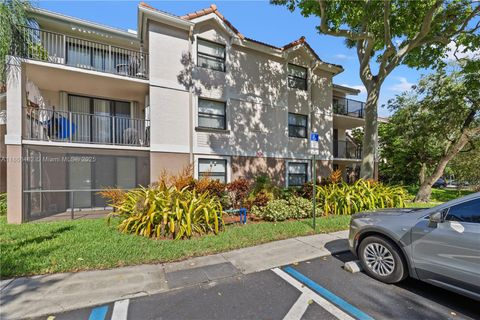 Photo of 10105 W Sunrise Blvd #104, Plantation, FL 33322 (MLS # A11866482)