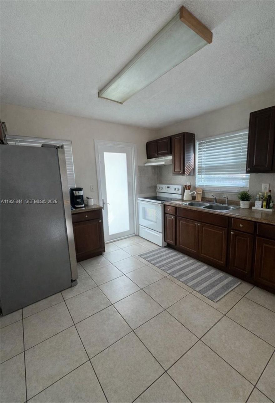 Move in ready 2 bed/2bath in Fort Lauderdale with quick and easy access to I-95, 1 mile from Ft. Lauderdale- Hollywood International Airport, and walking distance to Tri- Rail. This unit features a spacious floor plan with a open kitchen perfect for cooking and entertaining with stainless steel refrigerator, stove, central a/c for year round comfort, trash pick up, on site washer and dryer, 2+ dedicated parking spaces. No HOA.