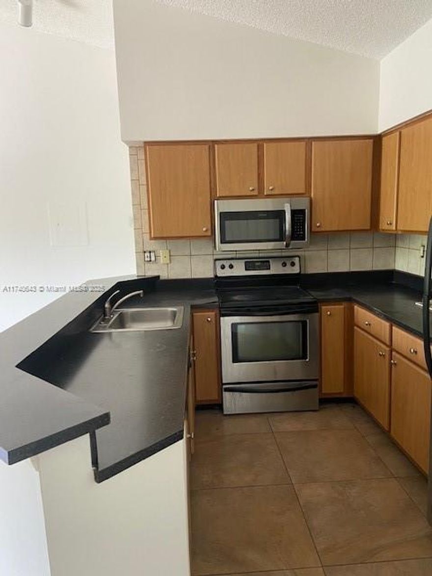 Large and updated  2 bed/2 bath condo in Marina Oaks! building is located right next to the pool and clubhouse and sought after by tenants or buyers -perfect location in the community ! Rent right away upon purchase! updated kitchen ,updated baths & stainless steel appliances -AC IS 1 YEAR OLD . Open living space ,  Split bedrooms. Tile flooring throughout the unit. New ac ,Newer washer/dryer & ceiling fans. Screened in balcony. Great location just minutes to FLL Airport, I95 & Marina Mile Blvd, Downtown, Restaurants & so much more! Great for investor or end user. community features pool, clubhouse  tennis & gym and blocks to Las olas , Beaches and the Airport .