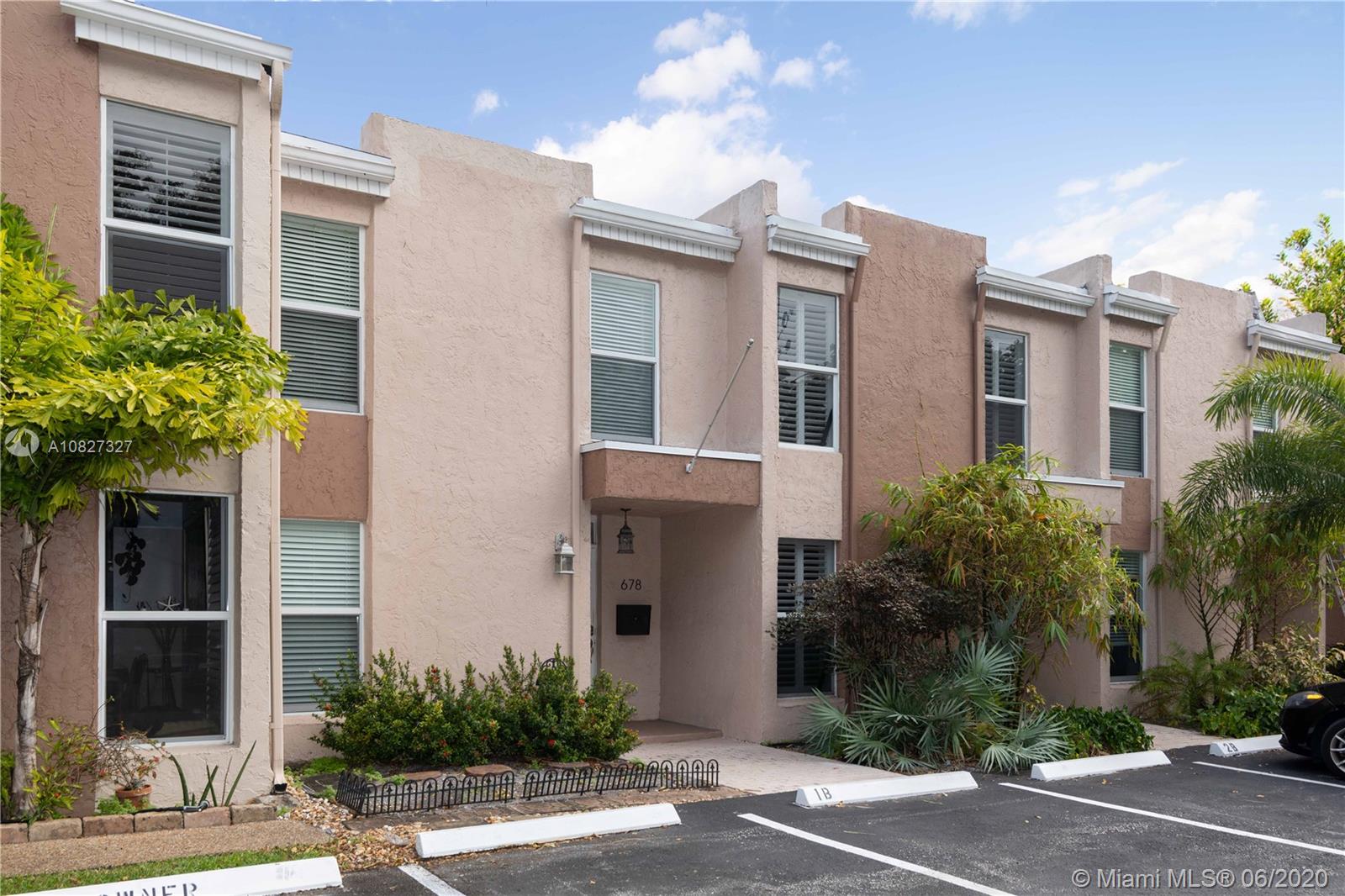 FANTASTIC VALUE IN THE HEART OF WILTON MANORS! 2 bedroom, 2 1/2 bath townhome on Townhouse Isle has it all - remodeled kitchen and baths, high-impact windows, doors and sliders, new full-size washer/dryer in separate utility area, new stainless steel appliances, granite counter tops, tankless hot water heater, working fireplace, NEW wood back deck and large balcony off the master bedroom. Each bedroom has an en suite bathroom. New roof installed in January 2020 and all assessments paid by seller. Amenities include waterfront pool and ample guest parking. Very pet-friendly!