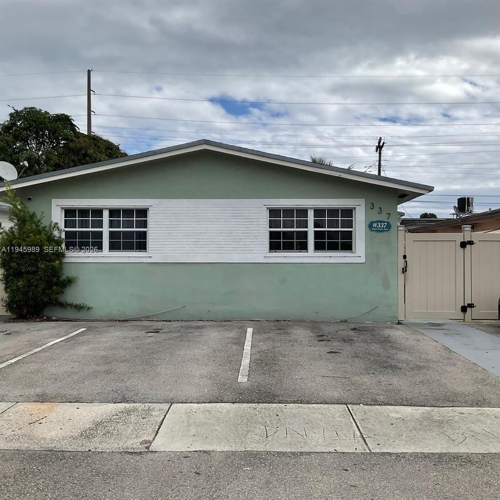 Photo of 337 Phippen Waiters Rd #1-2, Dania Beach, FL 33004 (MLS # A11945989)