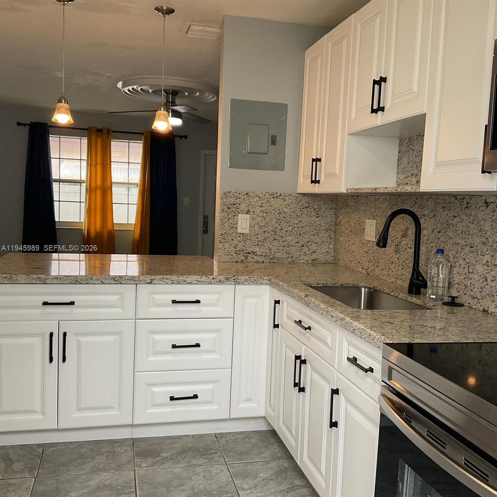 Photo of 337 Phippen Waiters Rd #1-2, Dania Beach, FL 33004 (MLS # A11945989)