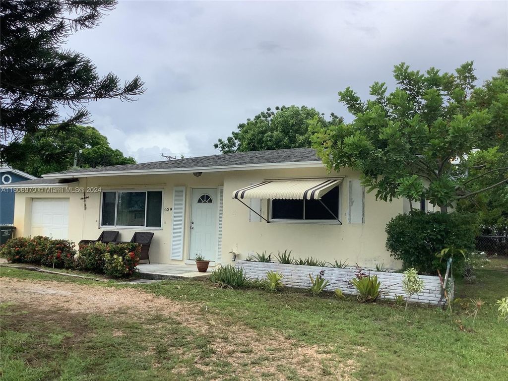 Photo of 629 Greenbriar Dr, Lake Park, FL 33403 (MLS # A11606970)