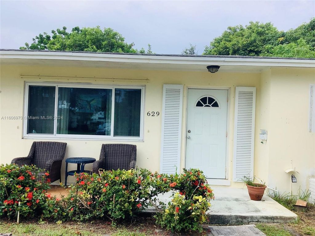 Photo of 629 Greenbriar Dr, Lake Park, FL 33403 (MLS # A11606970)