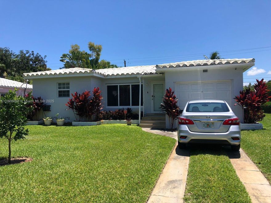 Single-story corner house with 2 bedrooms and 1 bathroom. Parking space available in the driveway and a one-car garage. Updated kitchen with modern stainless steel appliances. Renovated bathroom. Laundry area included. Hurricane-resistant doors and windows. New roof and A/C for added comfort and efficiency. Backyard with mature vegetation and natural fencing. Conveniently located near services, shopping, recreation, and major roads.