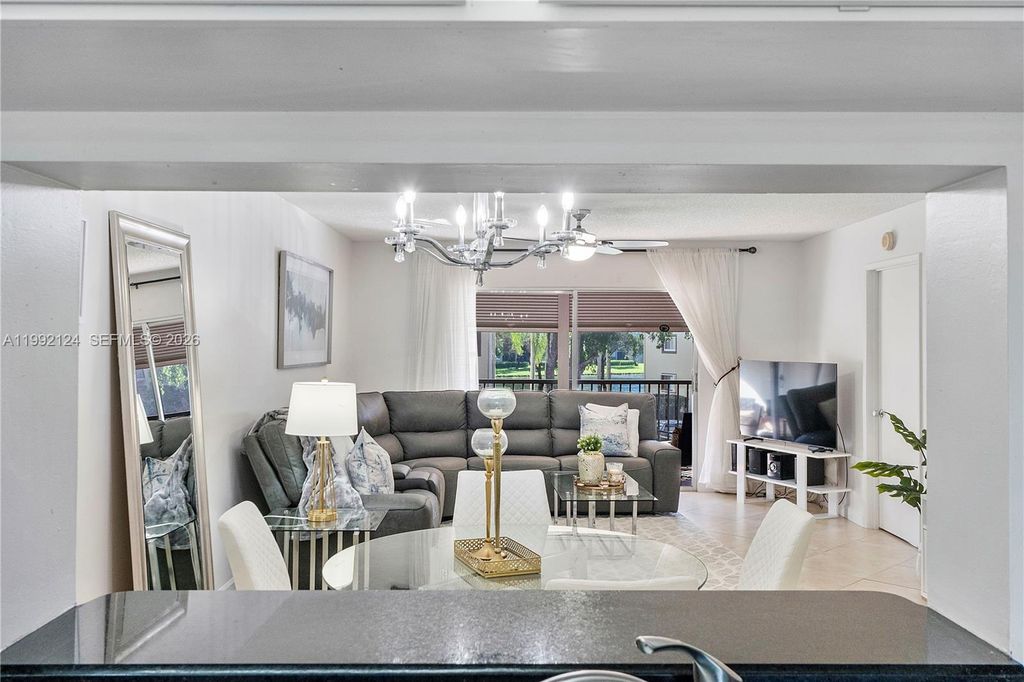 Photo of 1301 SW 142nd Ave #203H, Pembroke Pines, FL 33027 (MLS # A11992124)