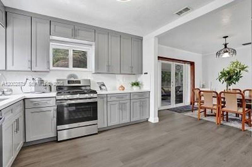 The most updated  and inviting home with an open floor plan, the perfect blend of style & comfort. Stunning new kitchen featuring quartz countertops and stainless  steel kitchen appliances. Recently updated include newly added Impact resistant window and doors, entire home feature newer flooring through-out and updated outfitted with high-end fixtures including a master shower system in the master bedroom. Enjoy indoor-outdoor living with a bright dining and living room area that opens to a screened-in patio, perfect for relaxing or entertaining guests. Additional features include: 3-year old A/C, Large shed, space for boat or RV, Gas stove, dryer and commercial grade water. Also for sale $ 649,000