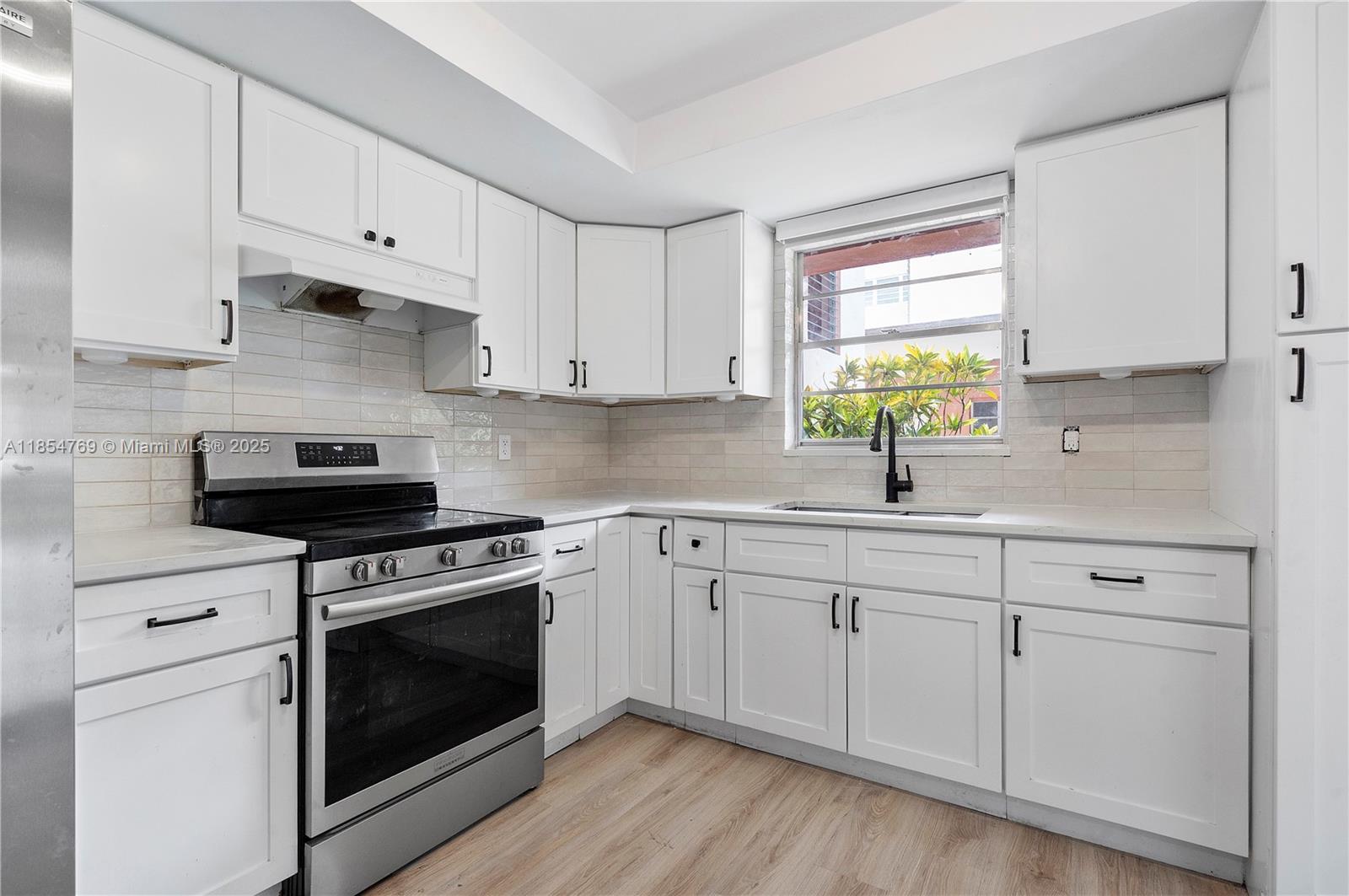 Beautifully renovated 1st-floor condo in the heart of Hallandale Beach! This spacious 2 bed, 2 bath unit features recessed lighting, great natural light, and a screened-in patio with peaceful garden views. Enjoy the quiet comfort of this well-maintained complex with a large pool, clubhouse, and lush green space. The unit includes one parking spot and a private storage unit. Located just minutes from the beach, Aventura Mall, Gulfstream Park, and countless shopping and dining options. Move-in ready, this condo combines modern updates with a prime location—perfect for full-time living or a vacation getaway. Don’t miss out!