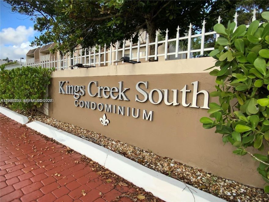 Kings Creek South spacious 2-be unit. Beautiful kitchen with SS appliances, remodeled bath, laminate wood floors, and new electrical.  Balcony faces tennis court and canal. Gated and well-maintained community with several pools, tennis courts, gym, and BBQ areas plus security patrol. Great Dadeland area location, close to shops, restaurants, schools, transportation, and expressways.
