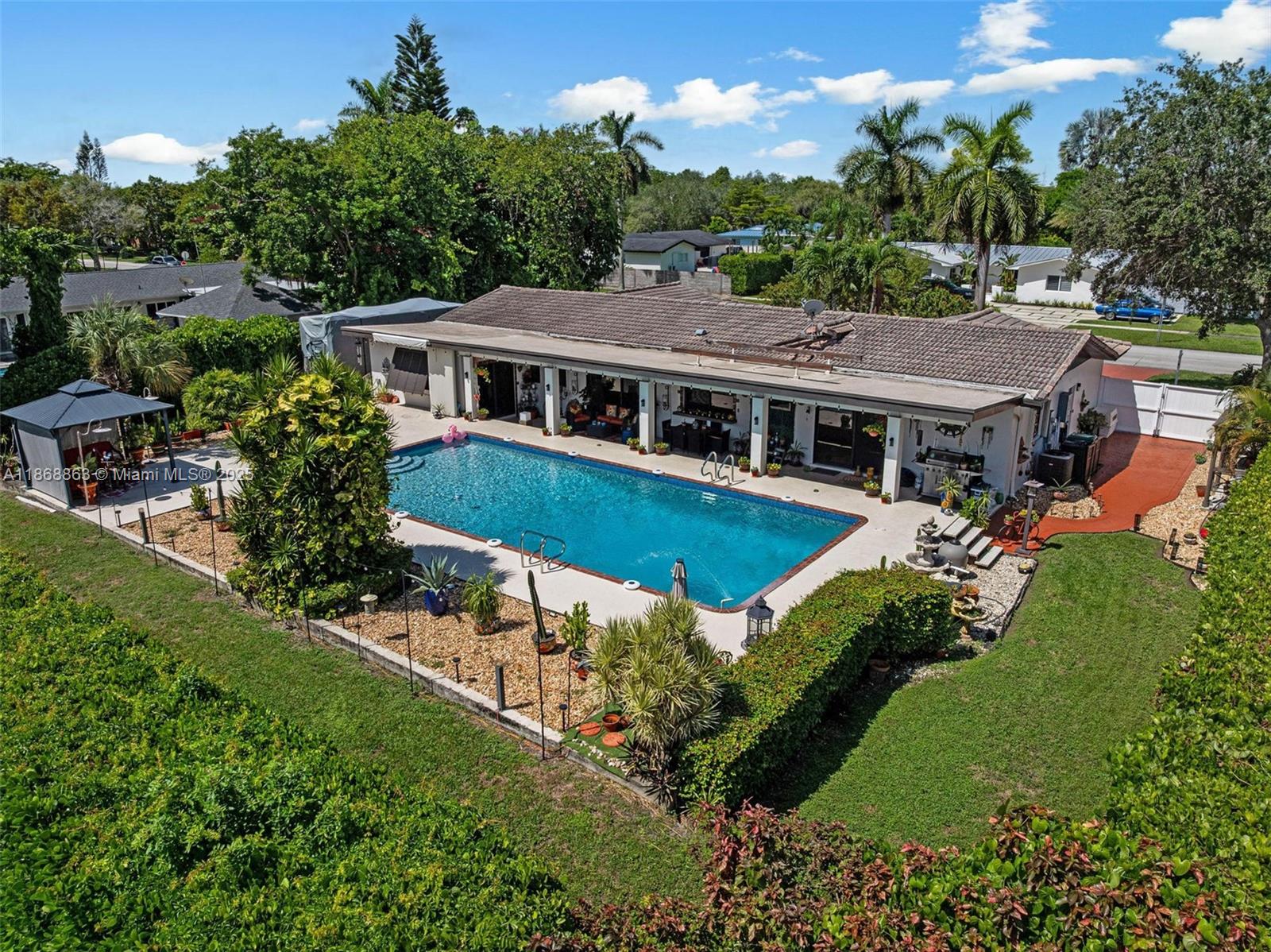 Nestled in the desirable Pine Acres neighborhood, this 4-bedroom + den, 2-bath residence sits on an expansive 16,605 SF lot with a versatile, spacious layout. Designed for entertaining, the backyard offers an oversized sparkling pool, covered patio, and generous outdoor space, along with RV/boat parking, a circular driveway, and a 2-car garage. For added comfort and security, the home is equipped with a whole-house permanent generator, ensuring peace of mind year-round.
