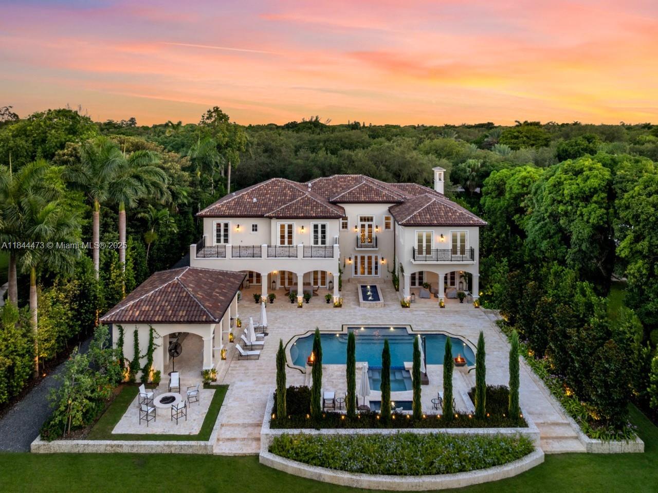 Exquisite Santa Barbara-inspired estate developed by Kenner Homes in coveted Ponce Davis. Extensively renovated, this 11,060 total SF residence offers 7 bedrooms and 8 full and 2 half bathrooms on a 42,003 SF lot. Interiors showcase soaring ceilings, architectural details, smart-home systems, elevator, wine room, and designer finishes. The principal suite features dual walk-in closets, spa bath, and private terrace. Step outside to a private oasis with lush landscaping, resort-style pool, spa, cold plunge, half-court basketball/pickleball, and a covered Summer Kitchen with Fire Magic grill. Ideally located near top schools, fine dining, and premier shopping, blending comfort and elegance to achieve modern luxury at its finest.