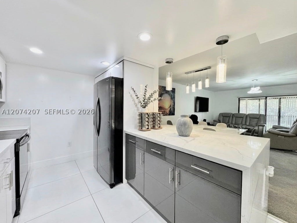 Photo of 3432 NW 86th Way #201, Sunrise, FL 33351 (MLS # A12074207)