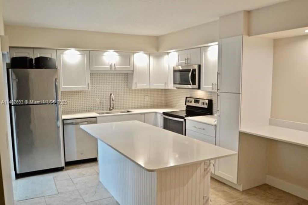 Photo of 818 8th Ln #818, Palm Beach Gardens, FL 33418 (MLS # A11402693)