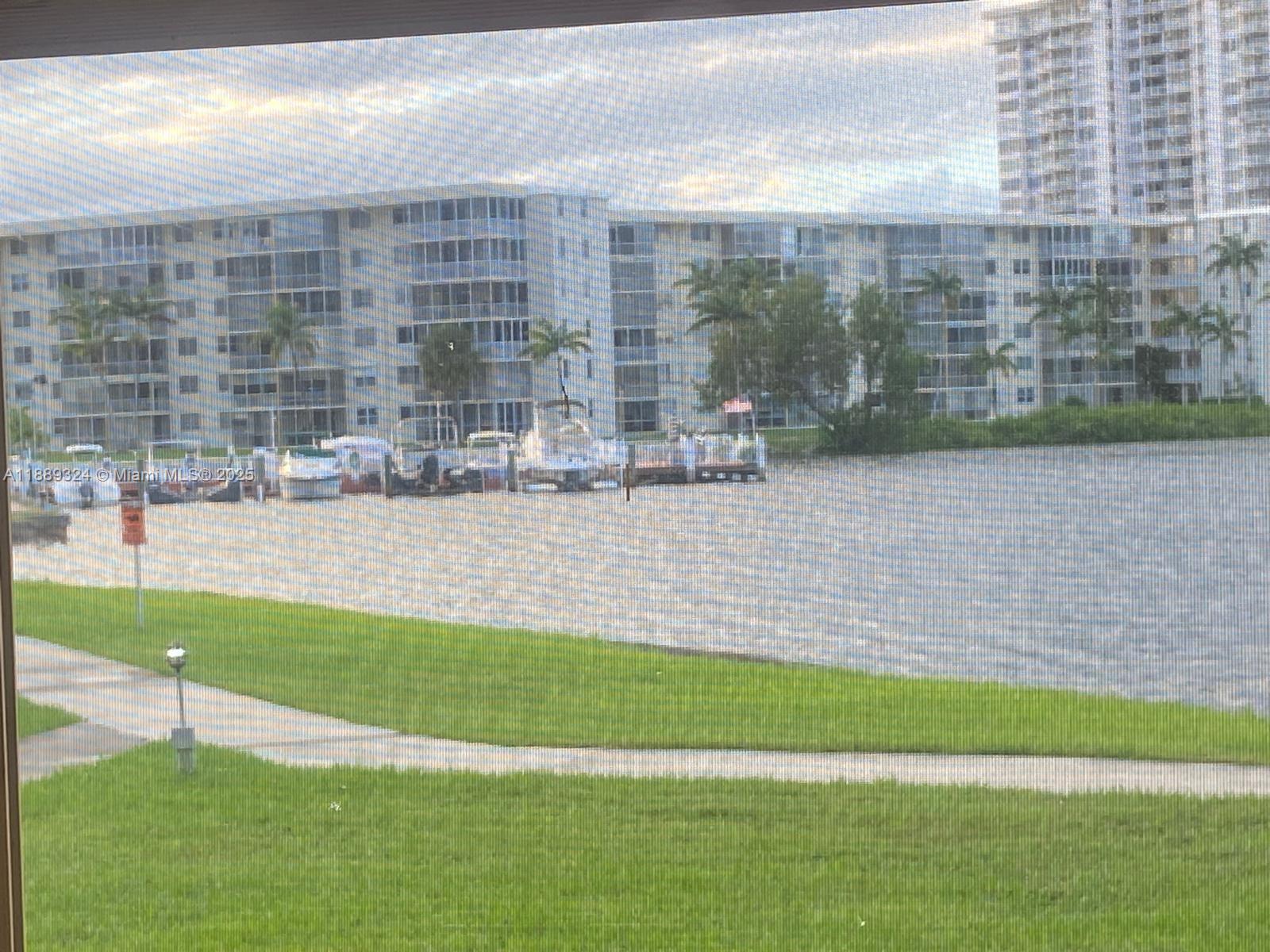Enjoy stunning bay and marina views from this spacious 2BR/1BA condo in the sought-after Point East 55+ gated community in Aventura. This first-floor unit offers 960 sq. ft. of bright living space with easy access and plenty of natural light. Relax by the water on scenic walking paths or take advantage of resort-style amenities: multiple pools, gym, clubhouse, theater, billiards, library, and courtesy bus. Point East also offers 24-hr security and waterfront picnic areas. Perfectly located near Aventura Mall, Gulfstream Park, beaches, dining, and highways, this condo is ideal as a primary home or seasonal retreat. Experience comfort, convenience, and breathtaking views in one of Aventura’s most desirable communities!
