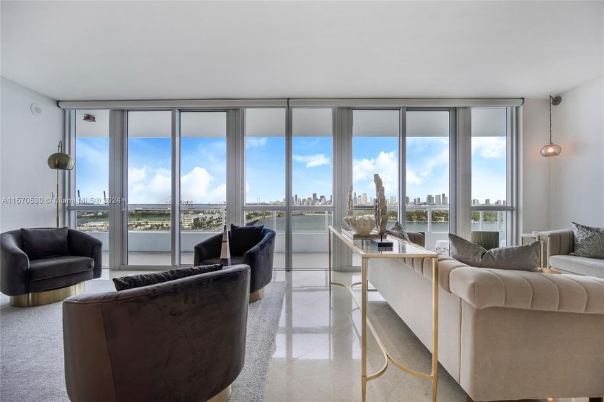 This fully furnished 2-bed + den/3rd bedroom with 3 full baths boasts a split bedroom floorplan, offering privacy and space. Revel in the stunning direct bay, downtown Miami, and port views from every room or your expansive balcony. With nearly 2,000 sq. ft. of living space, the open floorplan maximizes comfort. Upgrades include floor-to-ceiling windows, motorized solar shades, and a European kitchen. Bentley Bay features an amazing pool deck, gym, sauna, and steam room. Conveniently located near 395, enjoy easy access to SOBE, and step out to the new park right in front of the building. Walk to Whole Foods, coffee shops, and top Miami restaurants.