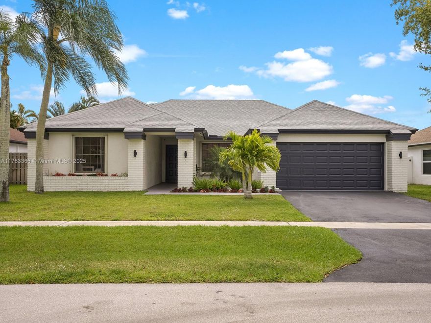 Meticulously renovated, turn-key home in the heart of West Boca! Offering over $100,000 in recent improvements; including updated appliances, custom closet systems, beautifully renovated bathrooms, and a full guest suite remodel. This light-filled home features an open floor plan and a spacious enclosed patio with a newly resurfaced saltwater pool, artificial turf and refreshed landscaping, as well as a new pool pump and sprinkler system. Enjoy peace of mind with a 2024 roof and solar fans, new HVAC system and ductwork, upgraded attic insulation, a new hot water heater, a full-house water filtration system, EV charging station, portable generator with transfer switch, and whole-home surge protection. Situated on a quiet cul de sac in a low $55/month HOA community.