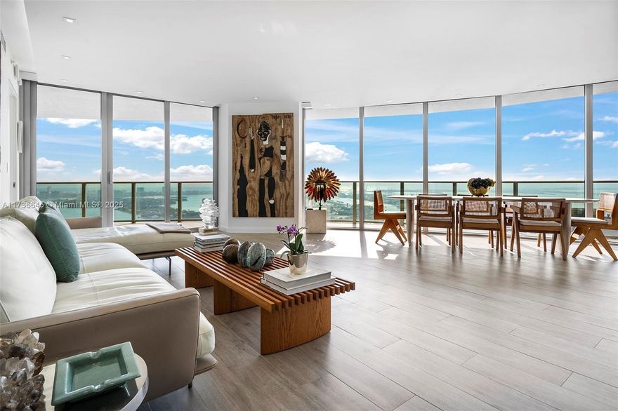 Experience unparalleled luxury in this exceptional Miami residence, offering breathtaking views of Miami Beach, Brickell, and Biscayne Bay. This 3-bedroom plus den, 4-bathroom home spans approximately 2,350 square feet, as detailed in the developer's floorplan. Every detail is meticulously crafted, with no expense spared.
Highlights include a custom-built kitchen with an expanded island featuring a water filtration system and instant boiling water, wine cellar, Italian frameless doors with superior noise insulation, and high-speed internet wiring system and home automation ready hardware. The master bathroom features custom cabinets, and the residence includes wired electric window treatments and bespoke closets. This unit is a must-see and one of the finest in the condominium.