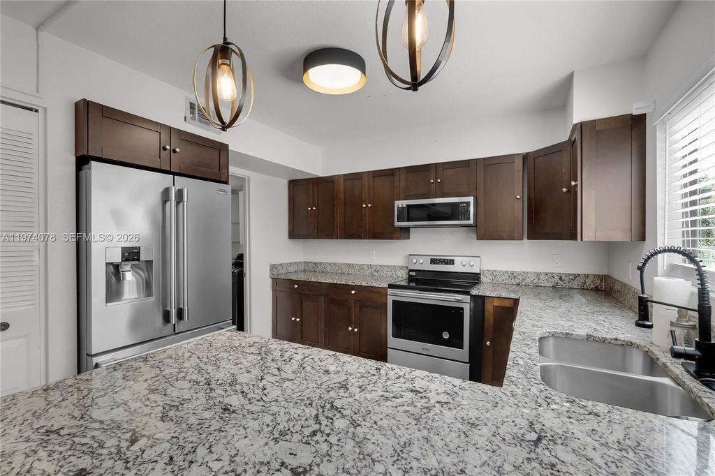 Photo of 1550 SE Dewberry Ct, Port St Lucie, FL 34952 (MLS # A11974078)