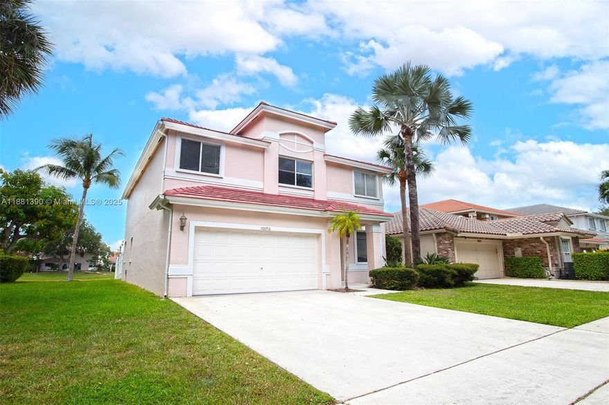 A must see! Beautiful 2 story single house with 5 bedrooms, 2 1/2 bathrooms. Large living-dining room and a bright room. Screen patio overlooking the canal. New blinds installed in bedrooms, living and dining areas. Tile flooring on the first floor and wood on the second floor- stairs and bedrooms. Oversized primary bedroom with closet and full bathroom.  Laundry room at first floor with direct access to the garage, fitting 2 cars. There is a storage closet underneath the stairs, very convenient.  Boca Springs offers amenities such as basketball, sand volleyball, and tennis courts. playground area, with picnic, swimming pool and plenty of parking. Well Maintained.