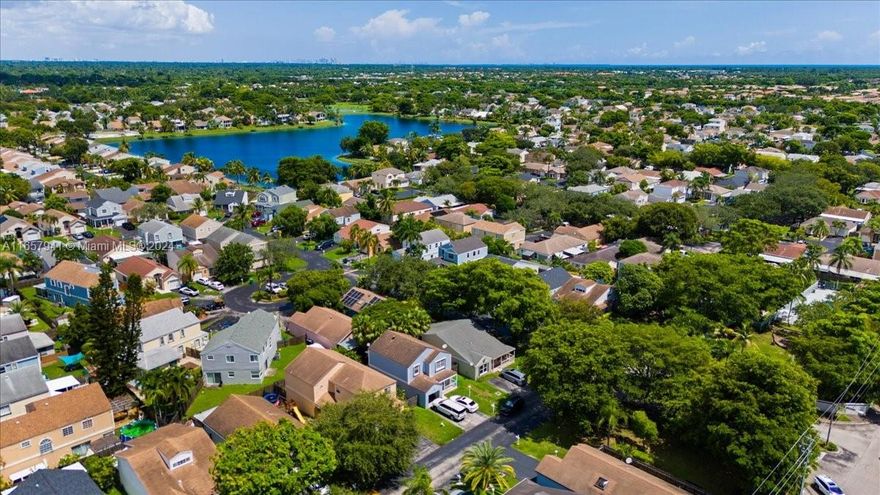 Welcome to Your Dream Home in highly coveted Lakes by the Bay. A stunning 4-bedroom, 2-bath residence on an expansive corner lot offers modern elegance and comfort. A sleek open-concept kitchen enhances its sophisticated appeal. Move-in ready with impact windows for added security, home features a wide layout with spacious sunlit bedrooms and a luxurious primary suite. Versatile 4th bedroom can also serve as a den, office, playroom, gym- Laundry in closet. Outside, a paved patio awaits for alfresco dining and relaxation. Garden area across from home for more space to play or entertain. Seamless access to expressway, top schools, shopping, and nearby entertainment. 200 SQ FT original to home unaccounted for (Total Living Area 1,448 SQ FT). Will not last - Call for Private or Virtual Tour.