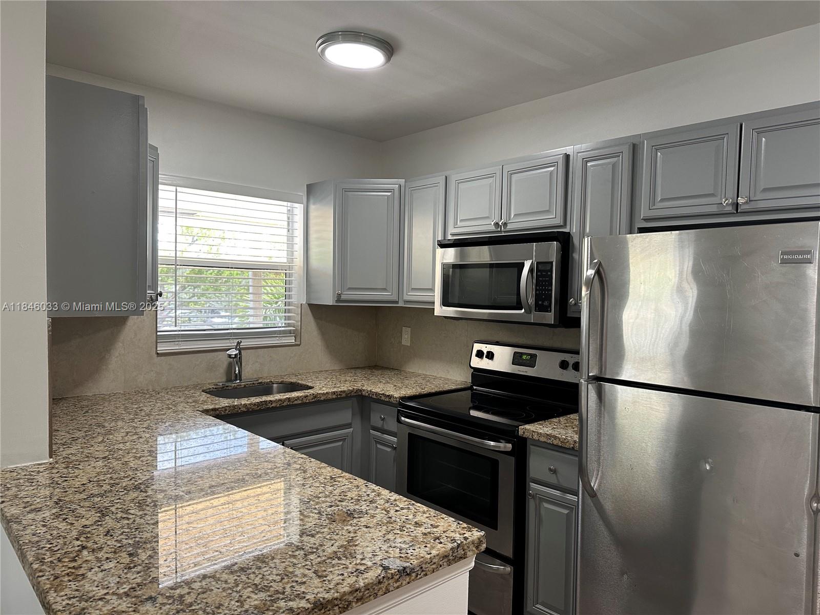 Cozy haven in Wilton Manors! 2-bed, 1-bath gem, located on the 2nd floor of a quaint building in a peaceful neighborhood. Unit is bright and spacious and boasts new lighting, new flooring, wood cabinets, granite countertops, central AC, impact windows, as well as upgraded appliances. The perfect space and the ideal place to call home! Basic utilities (water, waste, sewer, maintenance) are included, along with an assigned parking space. Plus, residents have access to a private green space, bike racks, guest parking, and convenient on-site laundry. Pets welcome with 1x non refundable pet fee. Property is tucked away on a nice street but also conveniently located near shops, restaurants, schools, parks, and recreation centers. Apartment is turn-key, rent ready!