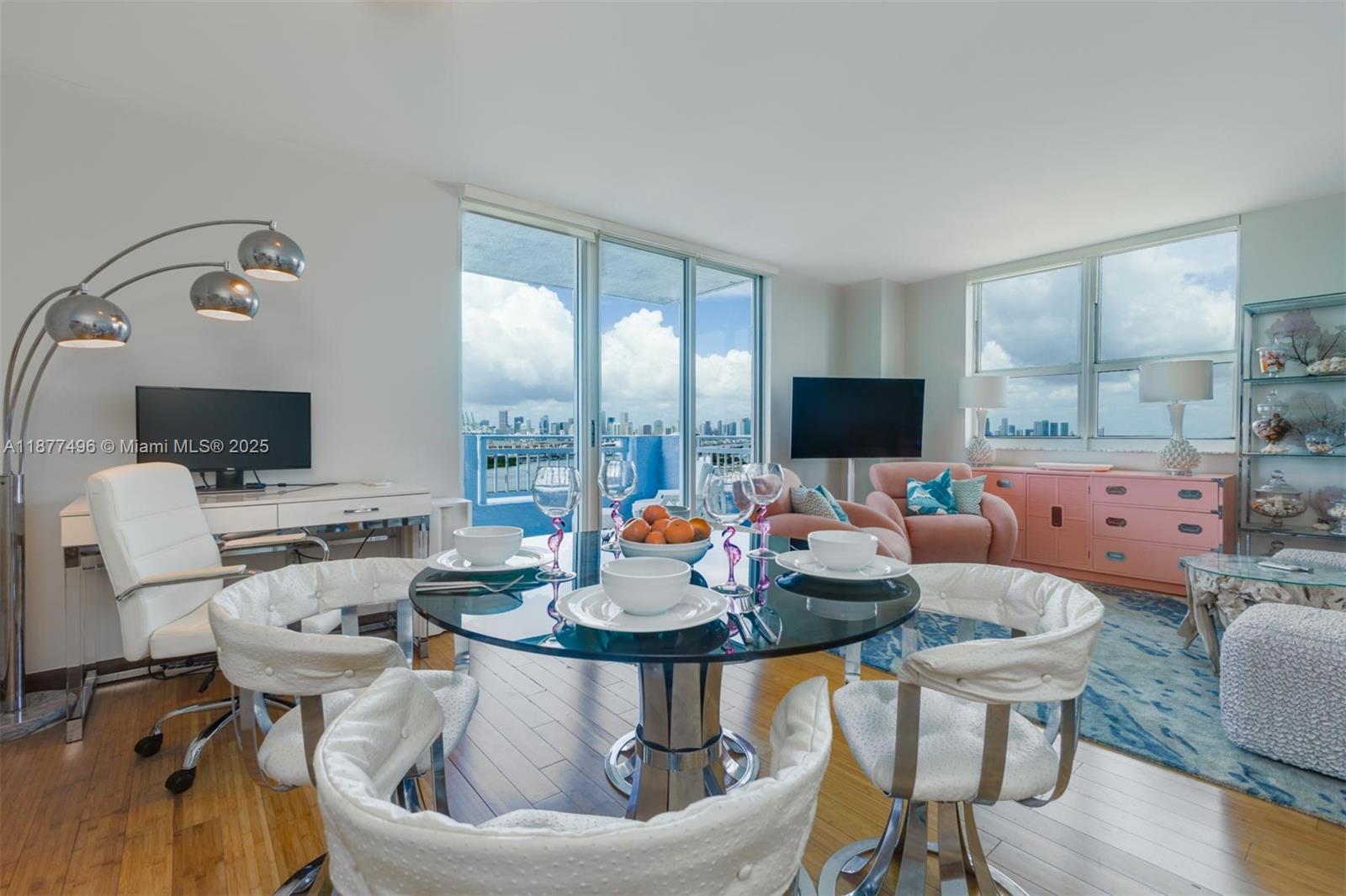 Retro chic 2 bedroom, 2 bathroom corner residence at The Yacht Club at Portofino, available for seasonal occupancy. Elevated on the 20th floor, it offers picturesque views of Port Miami, the Miami Beach Marina, Fisher Island, Downtown skyline, and the passing cruise ships, all set against Miami Beach’s breathtaking sunsets. Playful interiors feature vibrant pink furniture and stylish vintage touches. Experience the best season of Miami Beach with perfect weather, Art Basel, and Holiday festivities. Located in a full amenity tower with gym, pool deck with BBQ, and tennis. Steps from South Pointe Park, world famous dining, Ocean Drive, and Lincoln Road. Enjoy the scenic pedestrian walkway stretching the city, perfect for fitness and views, before ending your day on the beach.