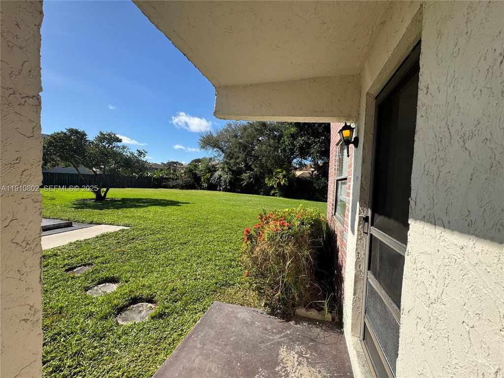 Photo of 6031 Shakerwood Cir #101, Tamarac, FL 33319 (MLS # A11910802)