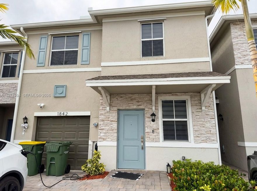 Welcome home to Marbella, a stunning new townhome community surrounded by lush greenery! Home features consist of stainless steel appliances, ceramic tile flooring, Paver driveways and porches and Home is Connected, America's Smart Home System! Homeowners will also enjoy Marbella's amenities; a community clubhouse, swimming pool, lake, observation deck, and walking path. Marbella is within proximity to Florida Keys Outlet Marketplace, Florida's Turnpike, local farmer markets, tasty restaurants, and the beautiful Florida Keys! Fully fenced patio covered with a beautiful modern pergola. 1-car garage.