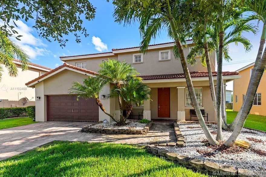 Location! Location! Stunning single family home in quiet gated community features 5 bedrooms 3.5 baths, 2 car garage. Open floor plan living, high vaulted ceilings, lofts overlooks well decorated sitting area downstairs. Beautiful wood floors throughout up & down stairs, large tile in bathrooms. Kitchen features newer appliances, self cleaning convection oven, granite counter tops throughout. Master bathroom features whirlpool bathtub, w/separate shower. Master Bedroom has his and her closets. Entire home has Hurricane proof windows and doors. Close to everything, schools, shopping plaza's, restaurants, parks, malls, stadium, and much more!! 5 minutes away from I-95, Turnpike & Hard Rock Stadium!!LOW HOA!! LOOK NO FURTHER THIS HOME IS TURN-KEY AND A MUST SEE!!