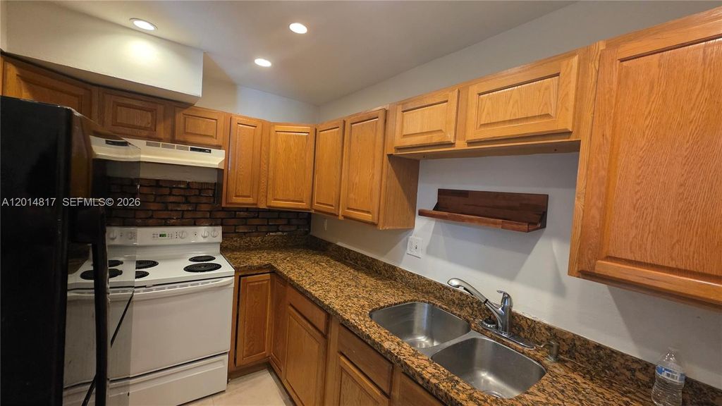 Photo of 5958 NW 24th Ct #1, Sunrise, FL 33313 (MLS # A12014817)