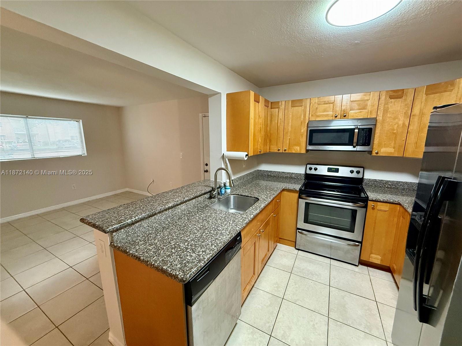 Enjoy easy living in this first-floor apartment in Pembroke Pines. Freshly painted and featuring a renovated bathroom, this bright and comfortable home also offers a big walk-in closet and washer and dryer in unit. Community amenities include a pool, gym, and tennis courts. Water/sewer included for added convenience. Walk to Tanglewood Park and enjoy nearby shopping, dining, and quick access to I-75. Pet under 20 Pounds allow.
