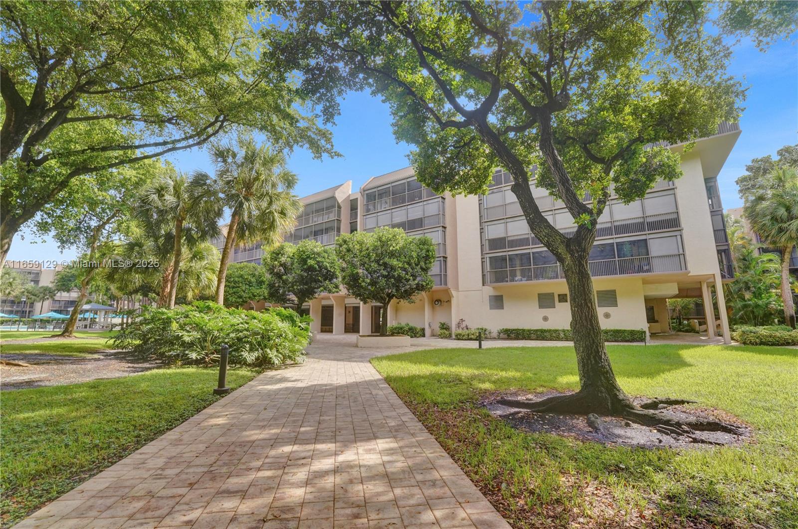 Welcome to your peaceful retreat! This exceptionally spacious & beautiful penthouse is strategically located in a quiet place of the building, offering serene views of lush trees & a manicured garden. This magnificent unit features a huge screened balcony, accessible from the living room & the two generously sized bedrooms. It features a new roof, SS appliances, an in-unit laundry, extra storage space & covered parking. Special Assessment already PAID. All ages. Resort-style amenities include an enormous/sparkling pool, sauna, gym, billiard room, BBQ area. The highly sought-after Grandview at Emerald Hills gated community is situated between Fort Lauderdale & Miami Airports & just minutes from Hollywood Beach, Hard Rock Casino, parks, world-class golf courses, restaurants & much more.