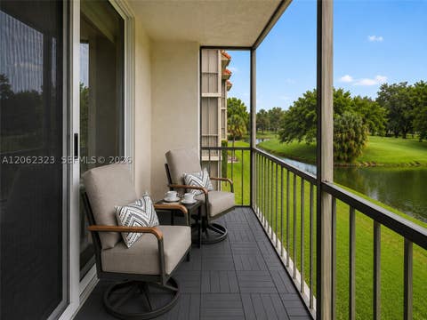 Photo of 800 S Hollybrook Dr #205, Pembroke Pines, FL 33025 (MLS # A12062323)