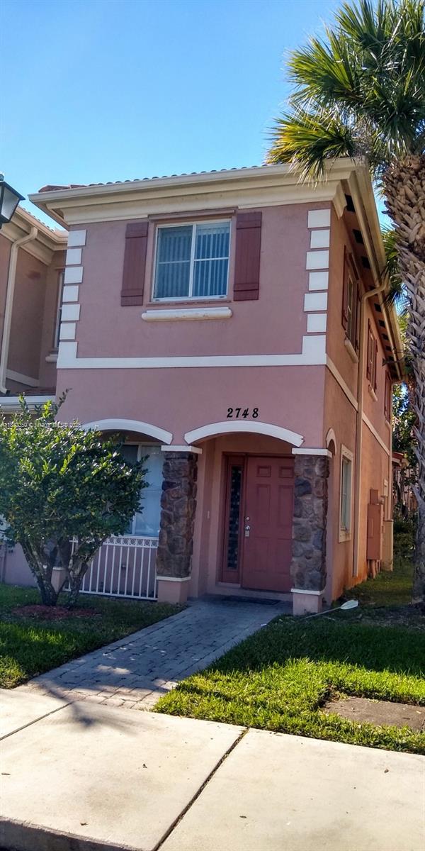 Spacious 3-bedroom, 2.5-bath townhouse located in a gated community. This freshly painted corner unit boasts granite kitchen countertops, ceramic tile on the first floor, brand new laminate flooring on the second, a family room, walk-in closet, full-sized washer and dryer, two front parking spaces, and a shaded patio. Community amenities include a pool and playground. ***EZ show - Click Show Assist***