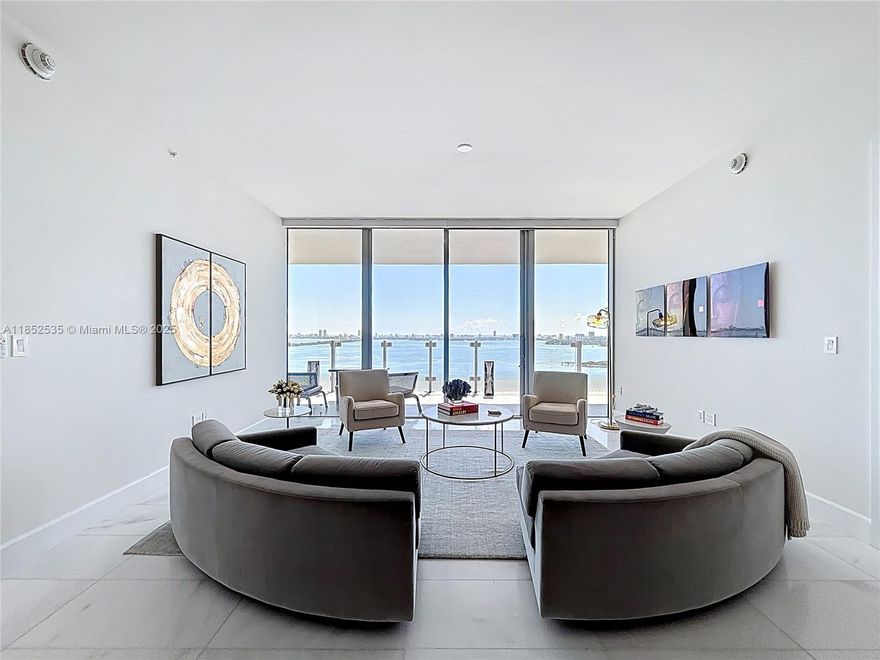 Own the views, the lifestyle, and the exclusivity at Missoni Baia! This 2-bed + den, 4-bath residence offers breathtaking, unobstructed bay and ocean views. Arrive through a private elevator that opens directly into your own foyer, setting the tone for an elevated lifestyle. The interiors have been elegantly refreshed with built-in closets, custom wallpaper accents, modern designer lighting, and a soft contemporary palette that compliments the natural light and clean architectural lines. The spacious open-concept layout features a gourmet kitchen with premium Wolf and Sub-Zero appliances. Enjoy resort-style amenities, incl. 3 pools, fitness center, yoga classes, a spa, tennis/pickleball courts, and private resident lounges—all curated with the artistic flair of Missoni’s iconic aesthetic.