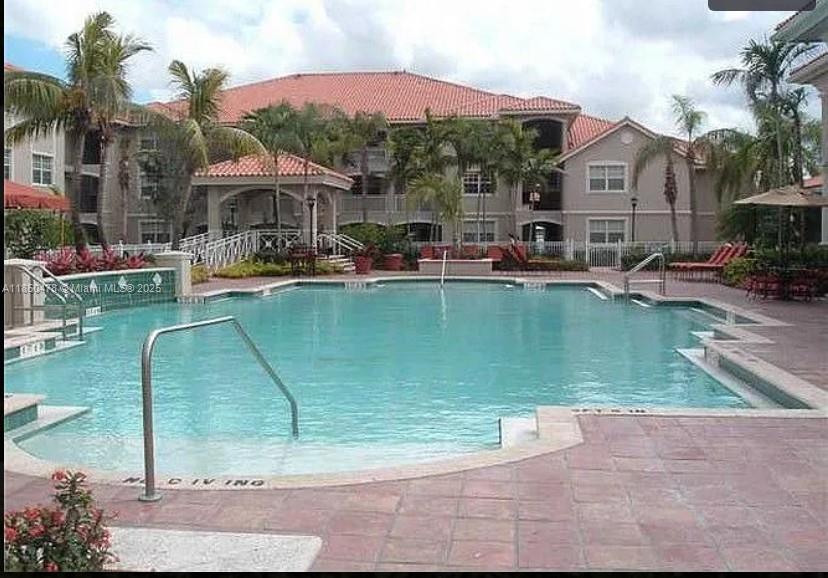 Beautiful lakefront apartment in a gated community The Marquesa with 1 Car garage.