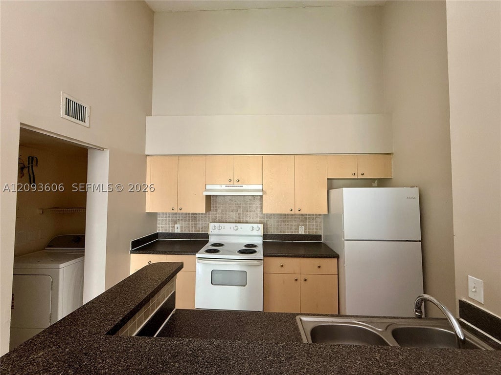 Photo of 4115 San Marino Blvd #202, West Palm Beach, FL 33409 (MLS # A12093606)