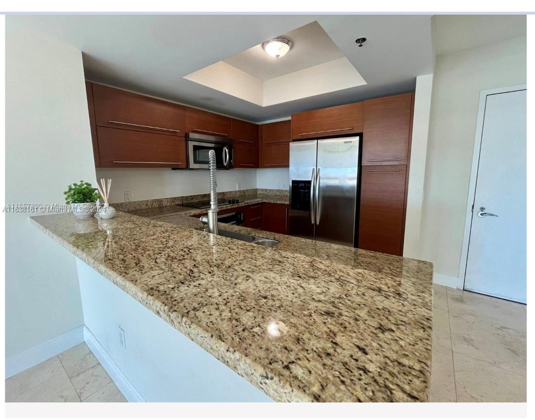 TAO SAWGRASS CONDOMINIUM - Residential Lease