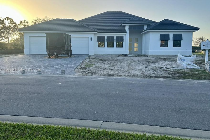 NEW CONSTRUCTION – Ready in 4–6 Weeks! This luxurious 3BR/3BA waterfront estate in Stoney Brook Farms blends "country quiet" with modern elegance. Highlights include a 3-car garage, private pool, and a high-end outdoor kitchen. The interior is finished with Italian tile, tray ceilings, and a chef’s kitchen featuring Calacatta quartz and a wine/coffee bar. Enjoy extra storage in the custom laundry/pantry suite. Located in a premier Vero Beach community next to the Polo fields and just 15 minutes from the Atlantic.